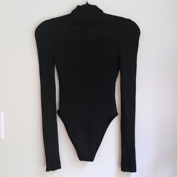 Alaia long sleeve wool blend ribbed knit bodysuit in black - Picture 5 of 12
